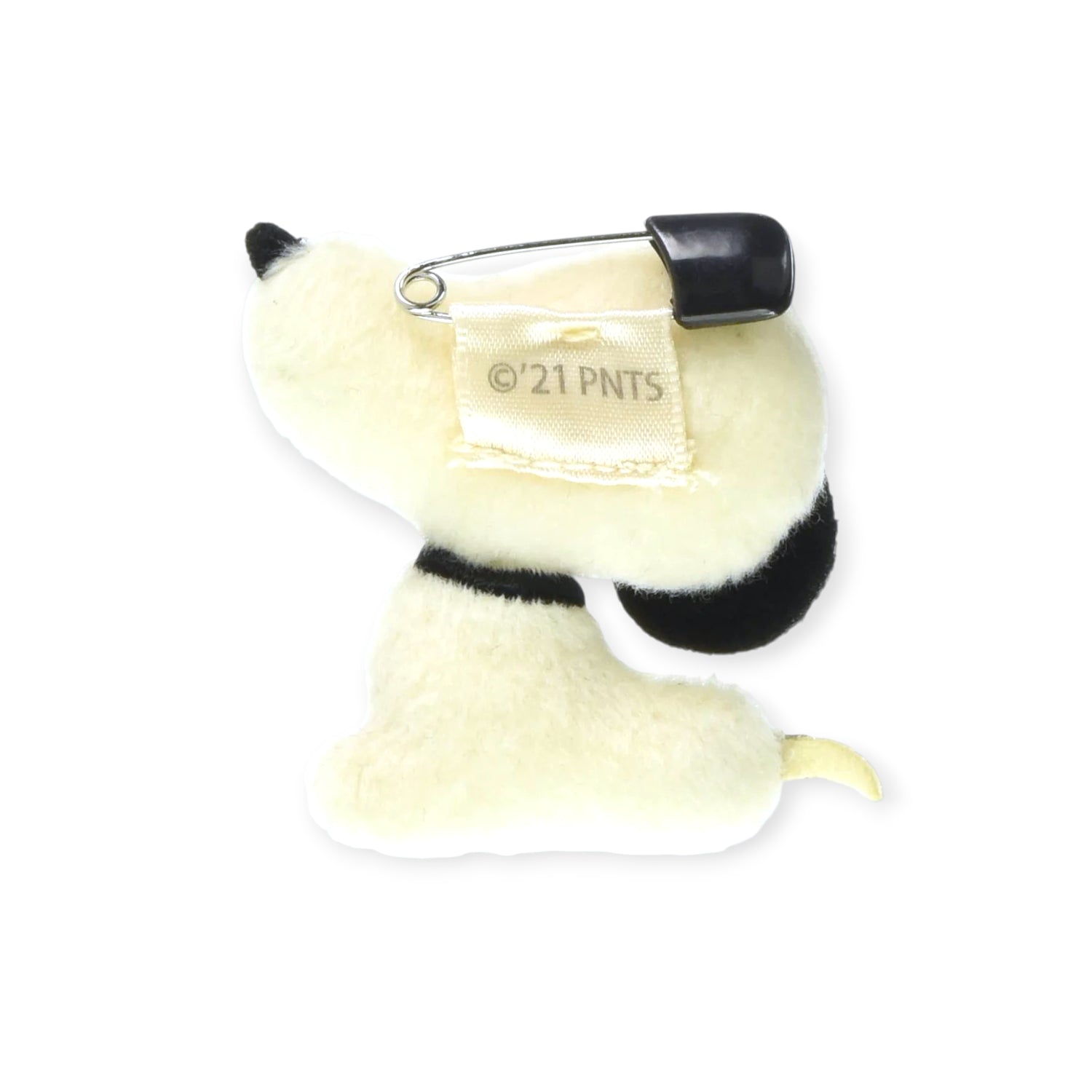 The Snoopy Vintage Plush Pin by Snoopy features a safety pin attached to a fabric tag on its back and is photographed on a white background, capturing the charm of classic vintage Peanuts style.