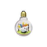 The Snoopy Blind Box - Weather Terrarium by Re-Ment showcases a delightful figurine scene set within a transparent spherical bulb, featuring a sheep, a pond, and decorative elements on green grass from the Peanuts Collection.