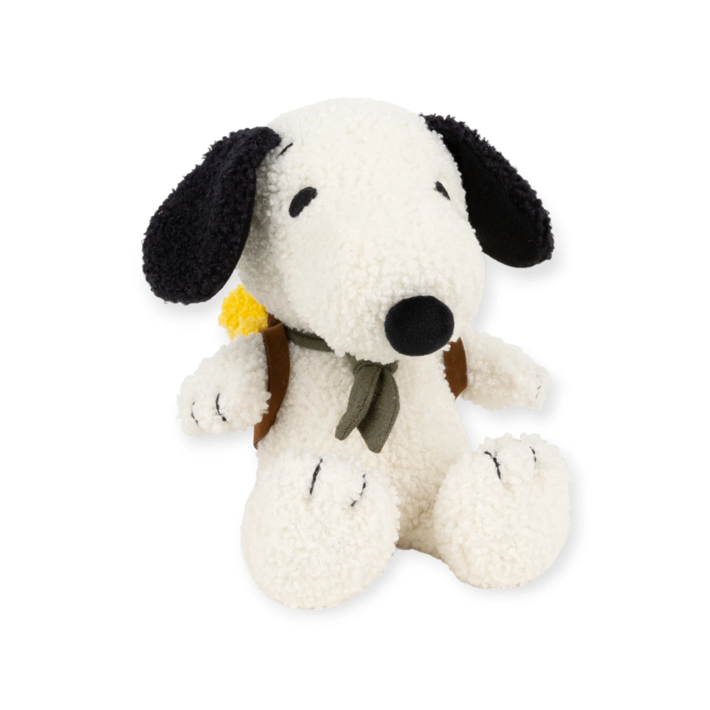 A 20cm Snoopy plush with black ears and nose, wearing an eco-friendly Woodstock backpack and a green scarf, is sitting upright.