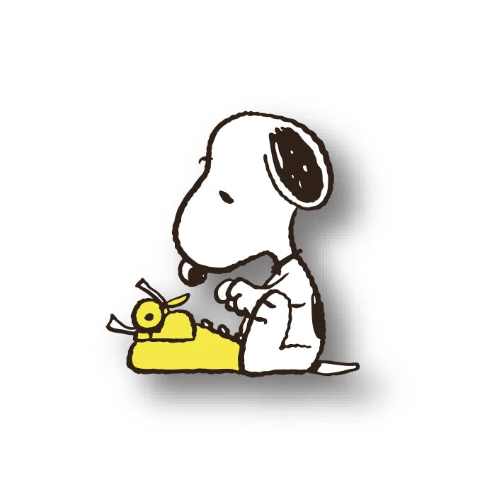 Snoopy pin showing Snoopy typing at a yellow typewriter