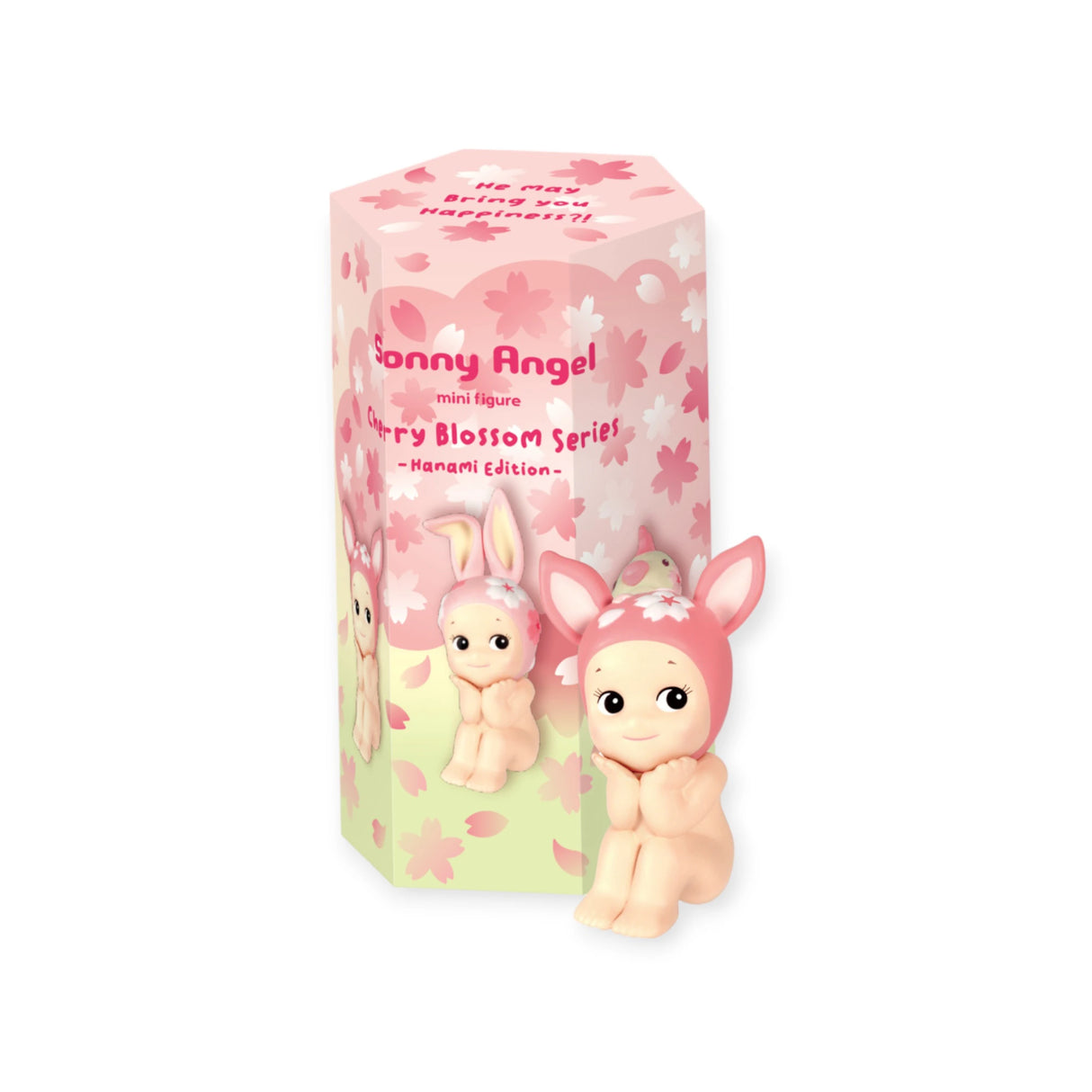 The limited edition "Sonny Angel Cherry Blossom Series" figurine, featuring bunny ears, stands beside a cherry blossom-themed box. This collectors' item is perfect for fans of Sonny Angel's unique and whimsical designs.