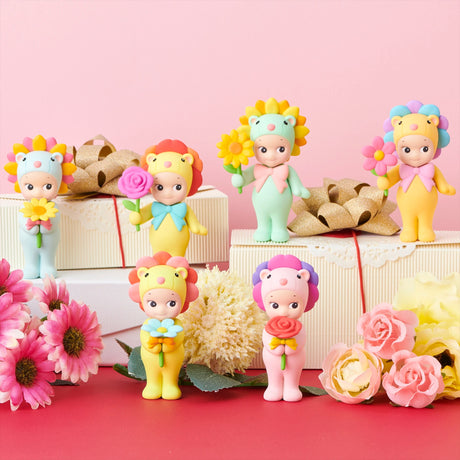 Mini flower gift toy figures with bouquets, arranged around decorative gift boxes