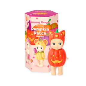 The Sonny Angel Pumpkin Patch Blind Box - Limited Edition features a mini figure in a pumpkin costume, displayed with its pink, pumpkin-themed packaging—an adorable addition to any Sonny Angel Halloween collection.