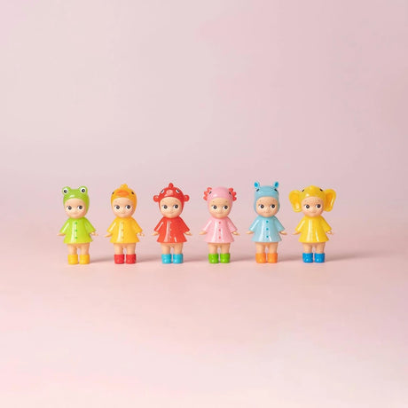 Six Sonny Angel Rainy Day Blind Box - Limited Edition dolls by Sonny Angel wear cute animal-themed rain outfits, standing in a row against a light pink background—a perfect collector's set for fans of Blind Box surprises.