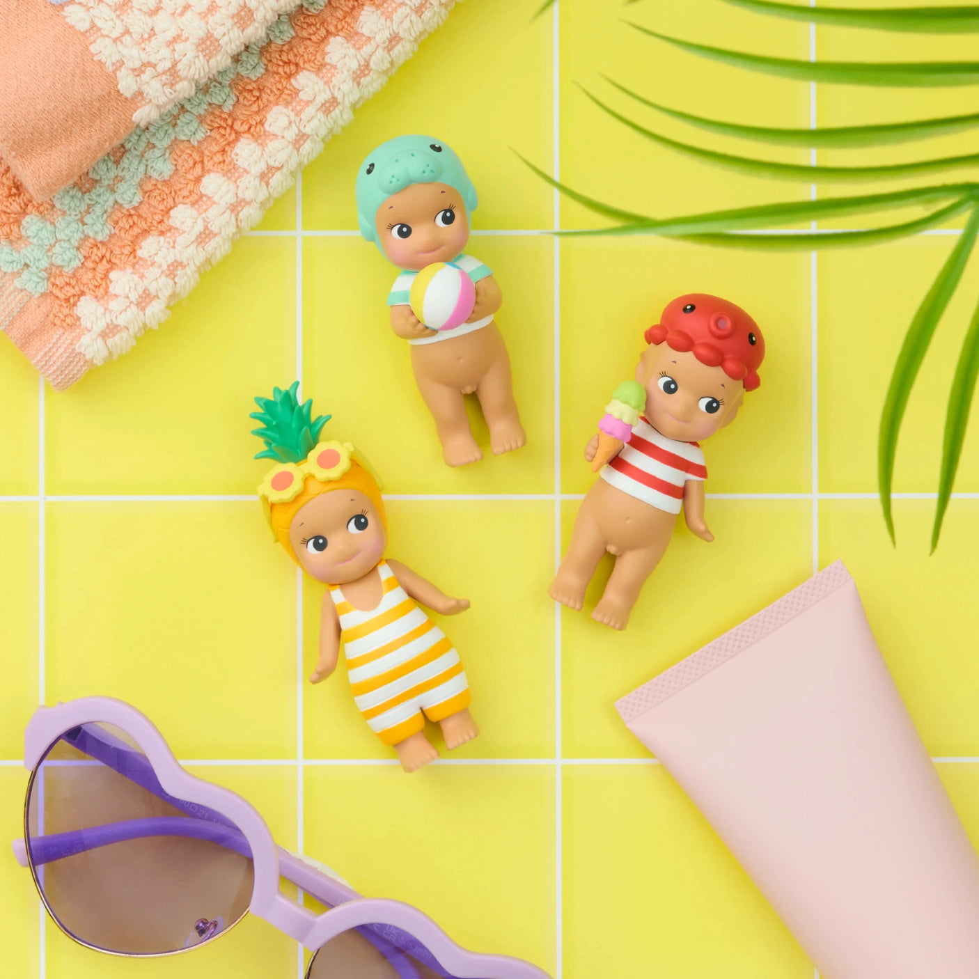 Sonny Angel Summer Vacation Sun Kissed figures in yellow striped outfits on table-top scene