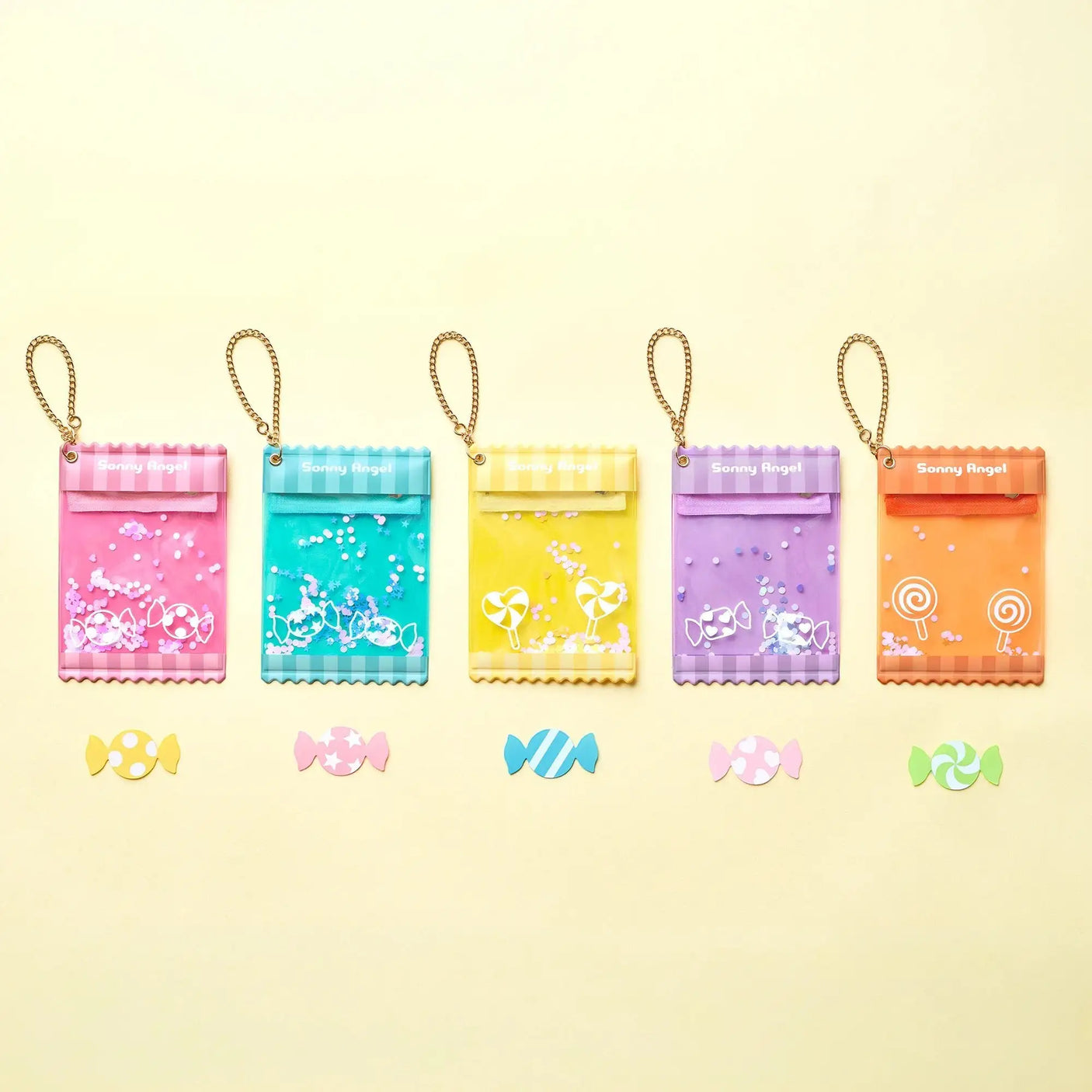 Row of mini candy pouch cases with chains in pastel colors, includes blue