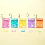 Row of mini candy pouch cases with chains in pastel colors, includes blue