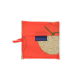 The Standard Baggu Bag - Yubari by Baggu is a red ripstop nylon pouch with a melon print and a blue "BAGGU" label in the center, made from recycled materials.