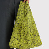 Held chartreuse paisley reusable tote bag with patterned fabric and gathered top