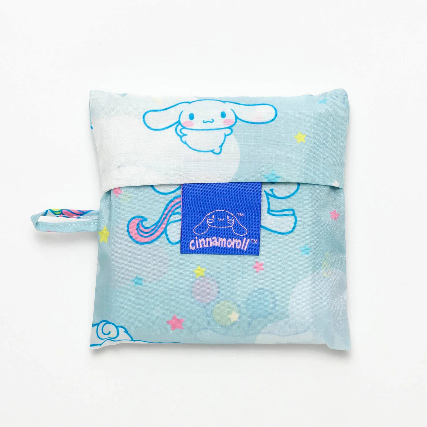 A Baggu Standard Bag featuring a Sanrio Cinnamoroll theme with blue and white patterns, showcasing a small character and stars, set against a crisp white background.