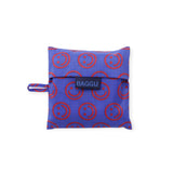 Folded mini Baggu tote pouch with BAGGU label and red smiley circle pattern