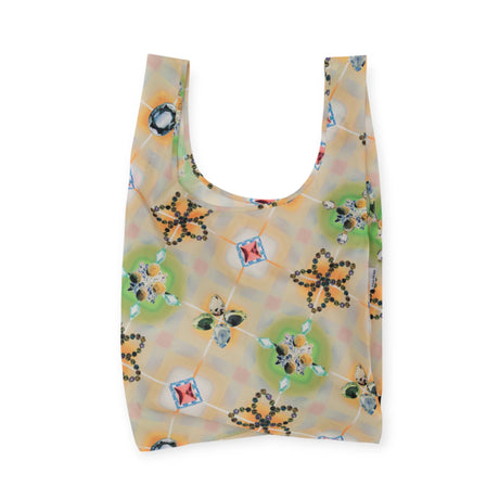 The Standard Baggu x Julia Heuer - Raisa is a durable, stylish reusable shopping bag featuring a floral and geometric pattern on a light background, crafted from recycled ripstop nylon.