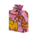 Keith Haring x Baggu Set of 3 Standard Bags by Baggu, featuring a playful design with cartoon animals on recycled nylon fabric, including a yellow dog and an orange spotted creature set against a pink background, tied securely with a knot on top.