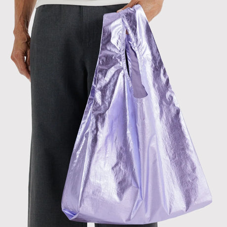 Baggu standard bag tote in lavender metallic, held open with long gathered top
