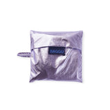 Baggu standard bag in lavender metallic, folded with blue logo patch
