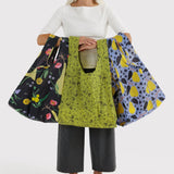 Baggu set of reusable tote bags, floral and paisley patterns held for display