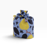 Baggu standard reusable tote bag, blue with yellow pear and star print, tied top