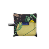 Folded black-and-yellow floral tote pouch with BAGGU label and tie strap