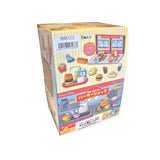 Box featuring a Re-Ment Sumikko Gurashi Burger Shop toy set, displaying vibrant graphics of small figures and furniture against a striped yellow background.