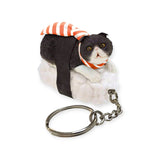 Introducing the Mofusand Sushi Cat Keychain Blind Box - Vol.1: a kawaii flair accessory featuring a charming black and white cat figurine dressed as sushi, complete with a striped orange scarf and metal chain.