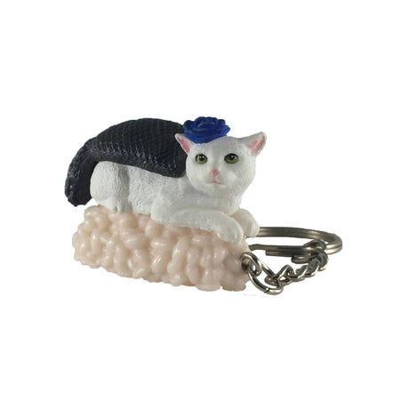 Mofusand's Sushi Cat Keychain Blind Box - Vol.2 offers a delightful surprise with its charming keychains, featuring a white cat figurine in a blue hat perfectly perched on a sushi roll. Part of the collectible Sushi Cats series, this quirky little charm might just be your next unexpected find!