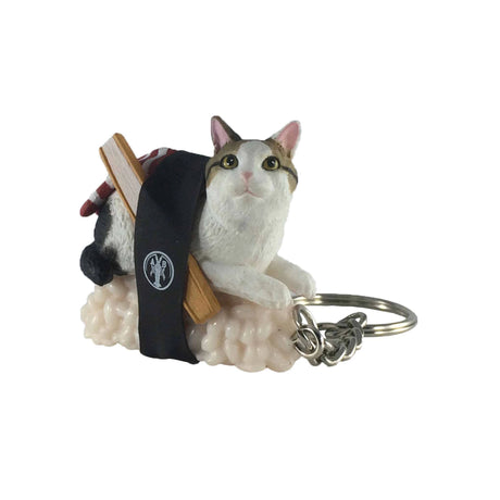 The Sushi Cat Keychain Blind Box - Vol.2 by Mofusand showcases an adorable cat relaxing atop sushi rice, adorned with a black band and chopsticks across its back.