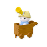 White baby animal figurine in wooden wagon with yellow cap and megaphone