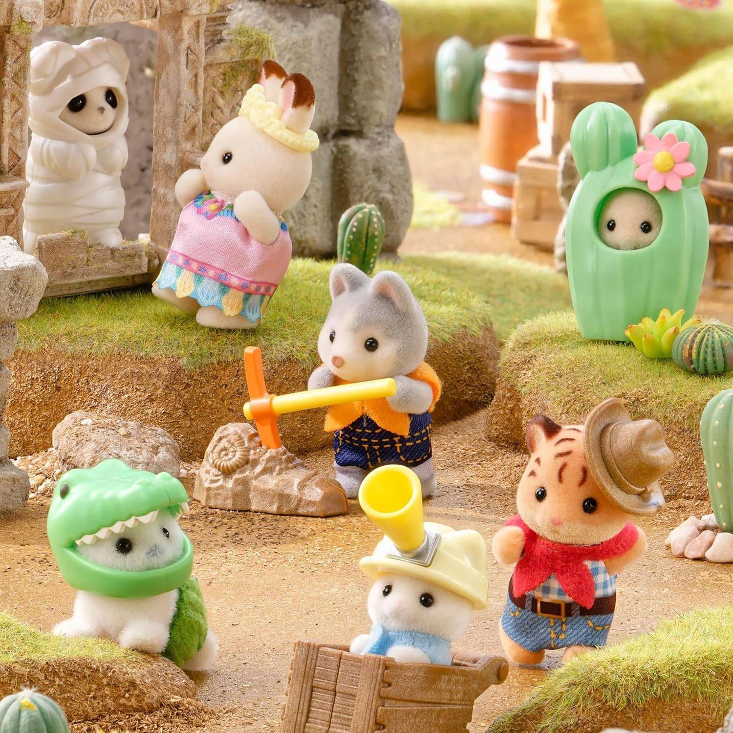 Assorted animal baby figurines with colorful accessories