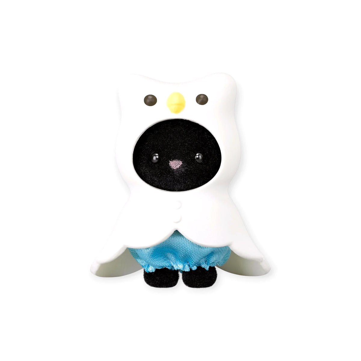 Black-and-white bear figure in a blue skirt, hooded with a starry pattern.