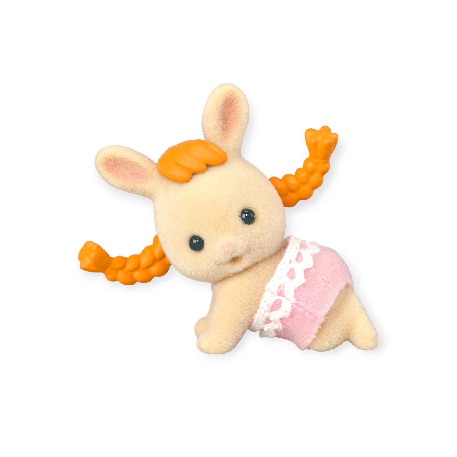 A Sylvanian Families Blind Bag - Baby Fun Hair figure, featuring a small rabbit with orange pigtails, black eyes, and a pink lace-trimmed diaper, is shown lying on its side against a white background.