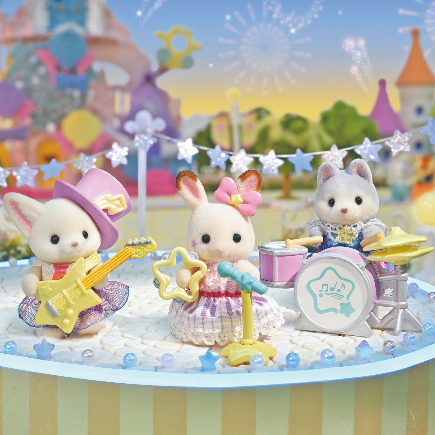 Sylvanian Families - Baby Starry Concert Set with three dressed baby animal figures playing musical instruments on decorated stage