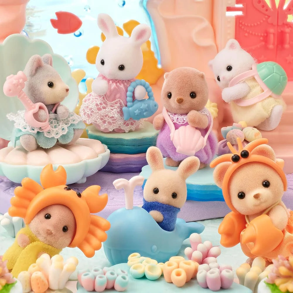 Sylvanian Families Blind Bag - Baby Seashore Friends Series features small plush animal toys in colorful sea-themed costumes, arranged with pastel props and ocean-inspired accessories. Brand: Sylvanian Families.