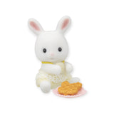 A white plush bunny from the Sylvanian Families Blind Bag - Baby Treats Series is dressed in a lace outfit and is seated with a plate of heart-shaped waffles.