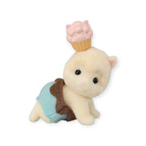 Discover the Sylvanian Families Blind Bag - Baking Baby Party, featuring an endearing plush toy cat from the collectible critters series. It's dressed in an enchanting blue and brown outfit, complete with a whimsical pink cupcake adorning its head. This charming toy is perfect for any Baking Baby Party or as a delightful addition to your Sylvanian Families collection.