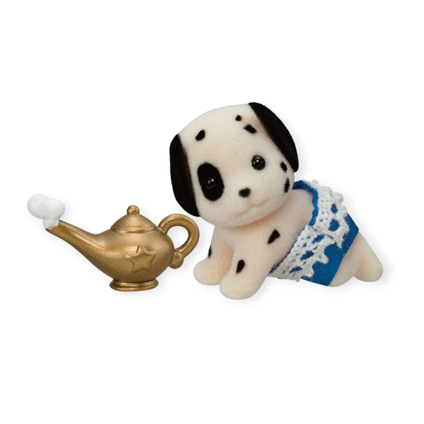 A Sylvanian Families Blind Bag - Magical Baby, featuring a small plush Dalmatian in blue shorts, is placed next to a toy golden genie lamp with a tiny white puff of smoke.