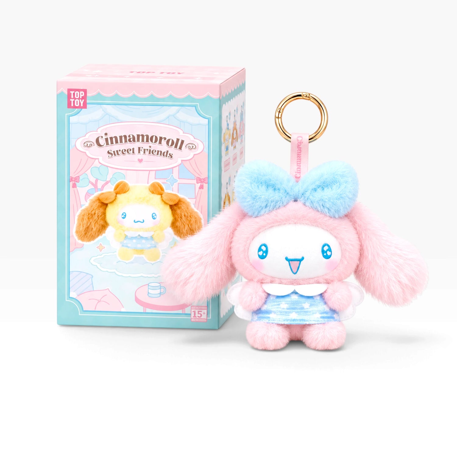 Pink and light-blue plush pendant keychain with bow, shown with Cinnamoroll box