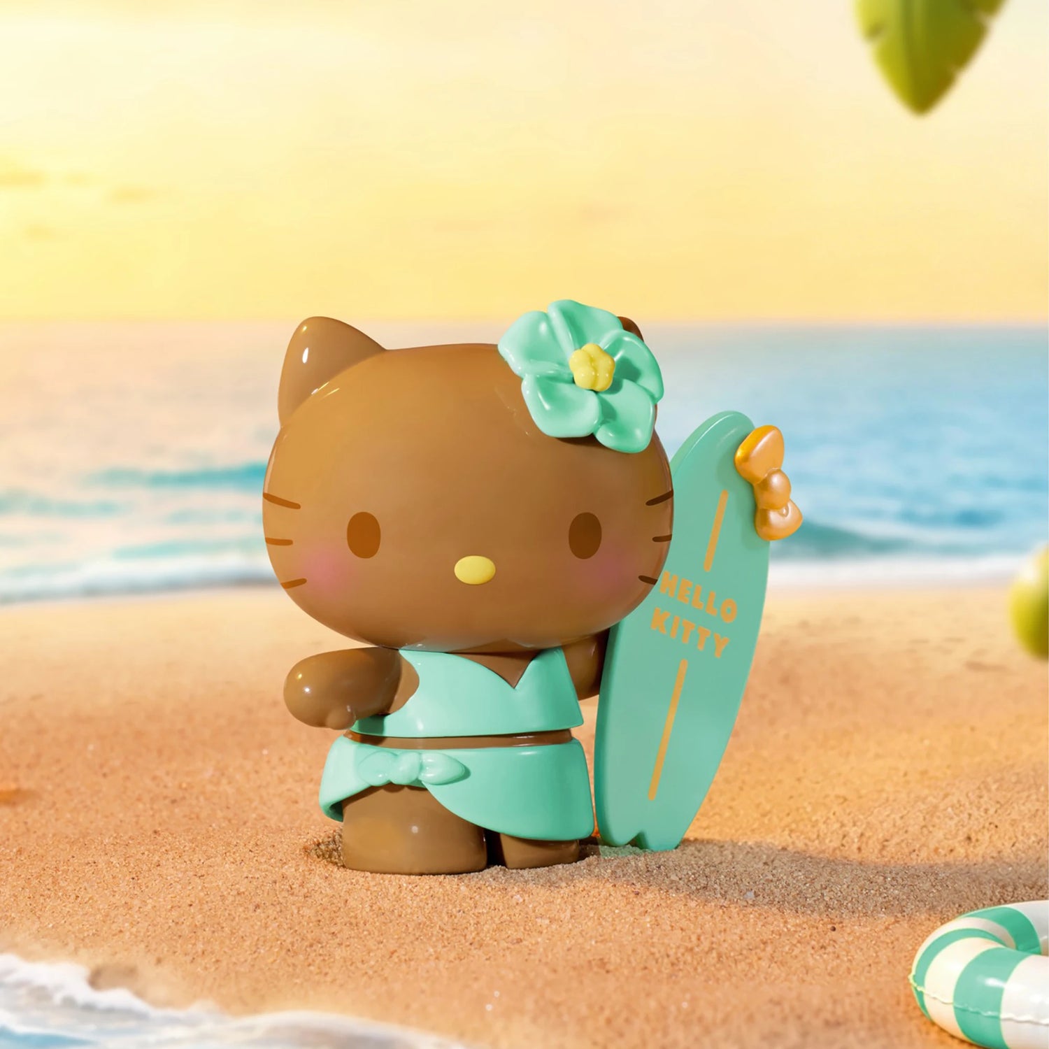 Hello Kitty summer beach blind box figure in teal outfit holding a surfboard