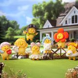Multiple duck blind box figures in different costumes arranged outdoors