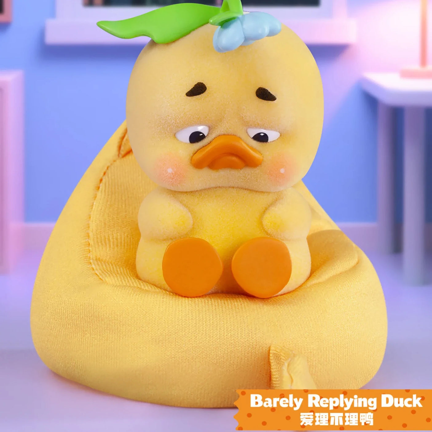 Upset Duck Blind Box - Stop The Spiral showing a yellow duck with a drooping leaf and sad eyes, seated on a yellow bean bag by Upset Duck
