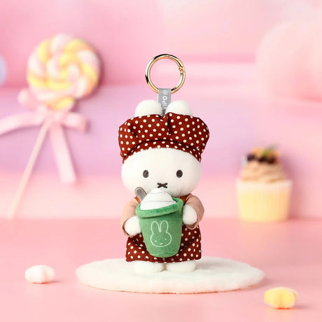 Rabbit plush keychain in brown polka-dot dress with green apron bunny patch