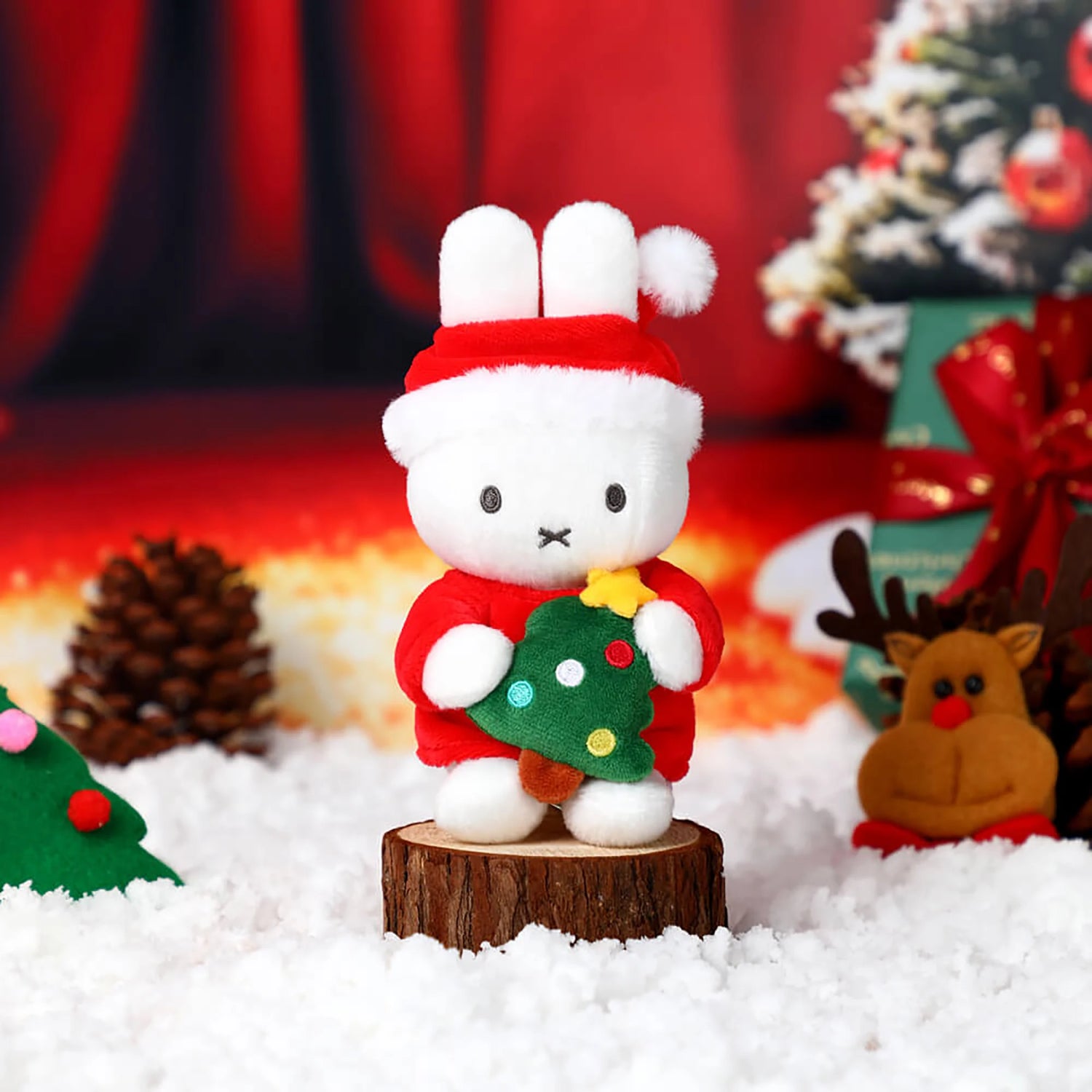 White rabbit Christmas plush keychain wearing red-and-white outfit with green tree ornament