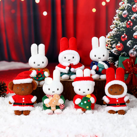 Christmas plush keychain assortment of multiple rabbit and bear characters on a snowy display