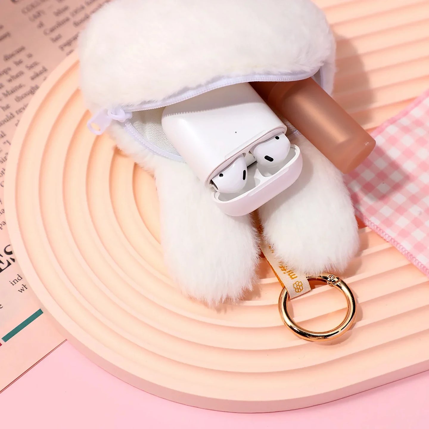 White plush bunny pouch keychain open zipper showing small interior pocket