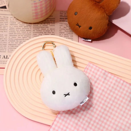White plush bunny pouch keychain with metal key ring and stitched face