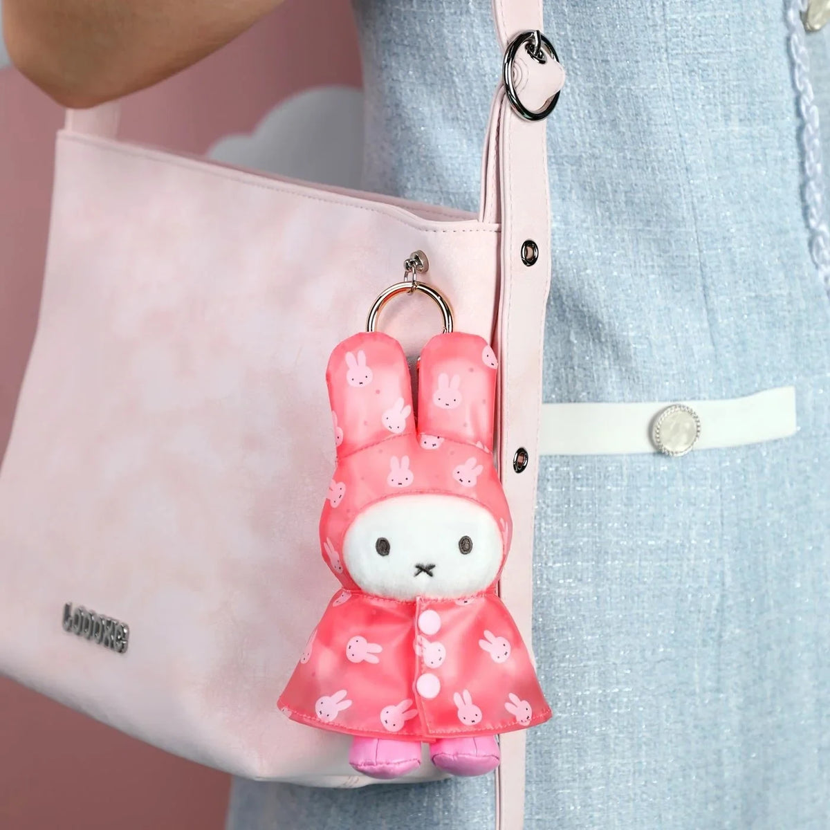 Pink plush rabbit raincoat keychain with metal ring and bunny print hood