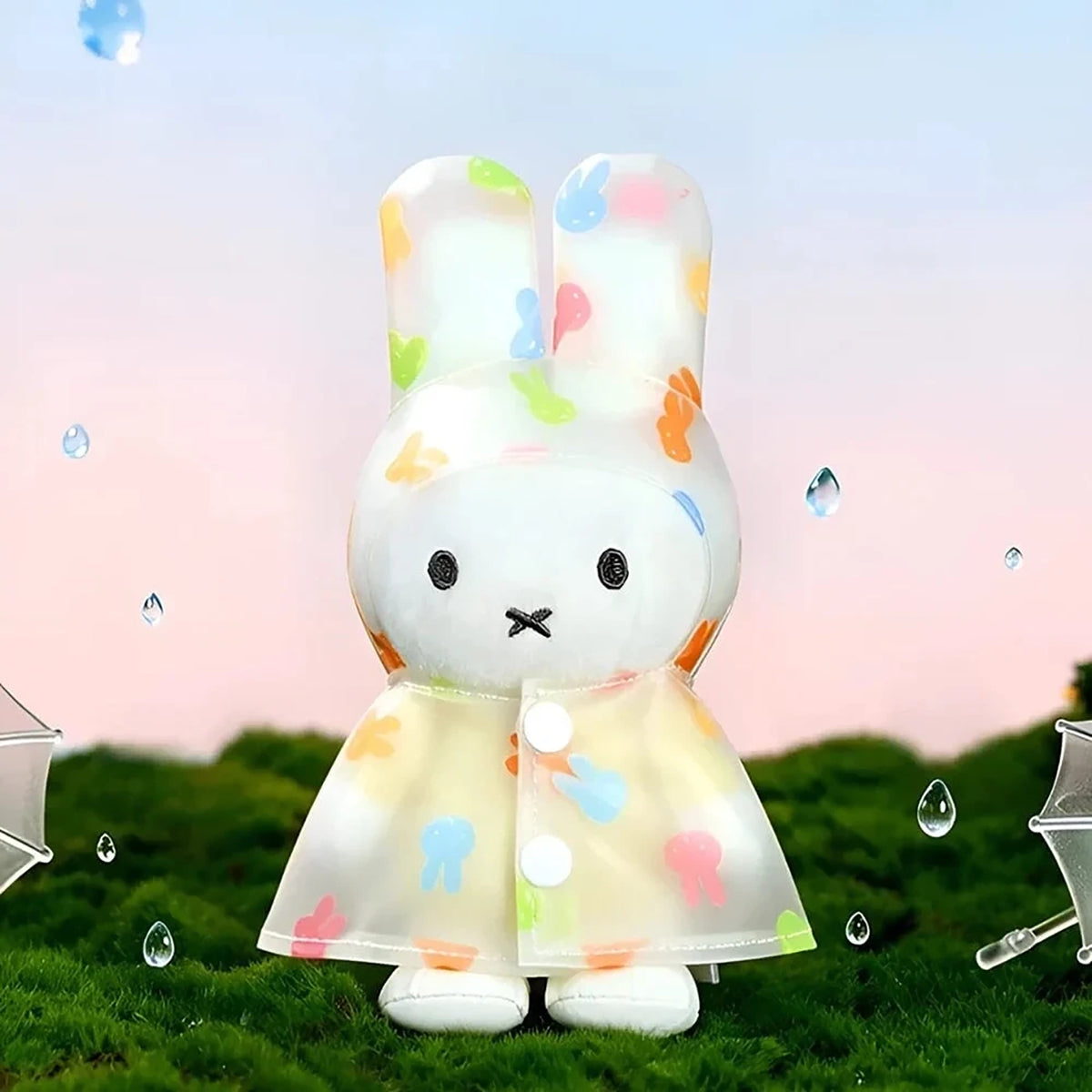 White bunny raincoat plush keychain with pastel hood and dot accents