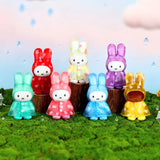 Assorted bunny raincoat plush keychains with colorful hooded dresses