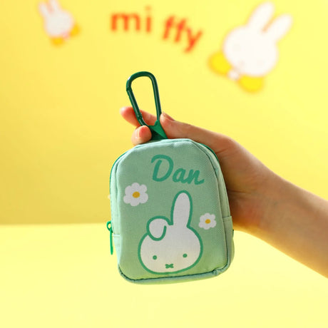 Green mini tote keychain pouch with miffy face, "Dan" text, zipper top and handle