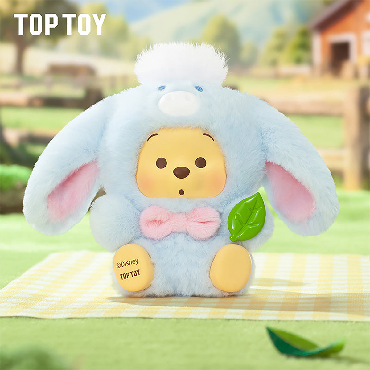 Light blue plush Winnie the Pooh rabbit costume figure holding green leaf