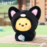 Black plush Winnie the Pooh bear costume figure holding a small white egg
